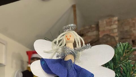 A Christmas tree angel made from a wooden peg
